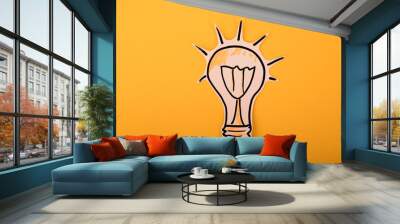 Paper bulb on a yellow background Wall mural