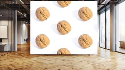 Ripe walnuts background, overlapping backdrop. White photo murals. Seamless pattern with walnuts. Decorative wallpaper, for printing Wall mural