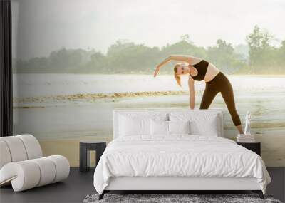 girl doing fitness on the Tropical beach Wall mural