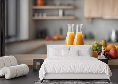 fruits and juice on wooden tabletop counter. in front of bright out of focus kitchen. copy space. Wall mural