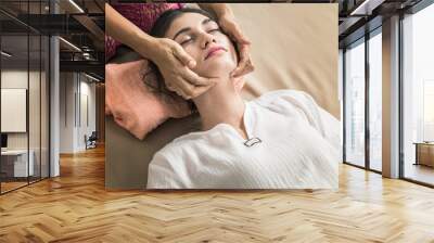 Young Girl get Thai style massage by Woman for body therapy Wall mural