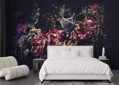 Bouquet of dried flowers. Dark floral background Wall mural