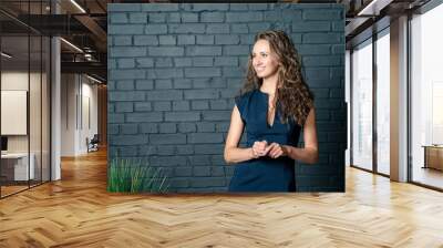 portrait of girl in front of a wall Wall mural