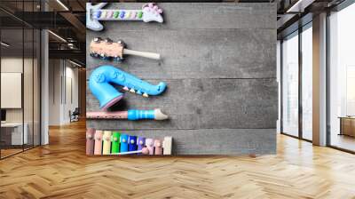 toy Musical instruments on wooden background Wall mural