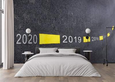 Number of 2019 to 2020 on asphalt road surface with marking lines, happy new year concept Wall mural