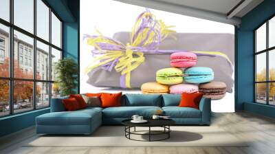 macaroon pyramid on a background of gift packages isolated on wh Wall mural