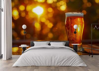 Glowing Pint of Beer on Wooden Table at Sunset Wall mural