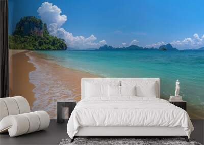 Serene beach with clear blue skies and inviting turquoise sea waters Wall mural