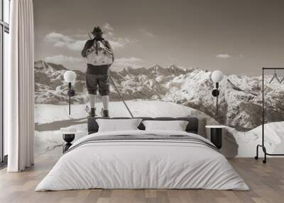 Black and white photos, Sepia Vintage skier with wooden skis Wall mural