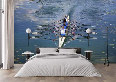 Four women rowing on the tranquil lake Wall mural