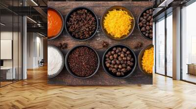 Overhead view of Christmas pudding ingredients on rustic wood cloves, orange zest, brandy, preparation for holiday baking Wall mural