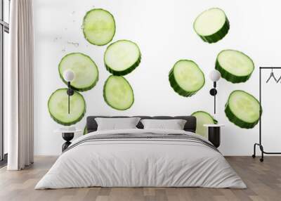 Falling cucumber slice isolated on white background, clipping path, full depth of field Wall mural