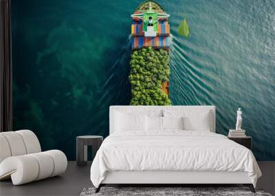 A ship decorated with green leaves symbolizes energy-efficient and sustainable use at sea. Wall mural