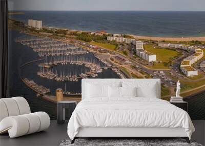 Aerial panoramic view of landscape with boats and sea in marina bay in Burgtiefe-Südstrand, Fehmarn, Germany. Aerial view of landscape with marina and sea resort on the Baltic Sea island of Fehmarn.  Wall mural