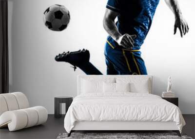 one caucasian soccer player man playing in silhouette isolated on white background Wall mural