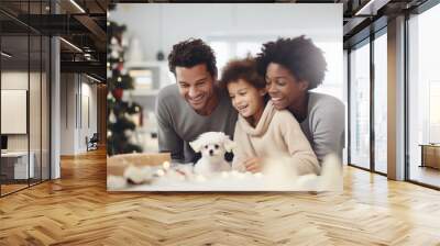 A multiracial family in their living room during the Christmas holiday season receives a special gift from Santa Claus: a new addition to the family, an adorable puppy. Wall mural