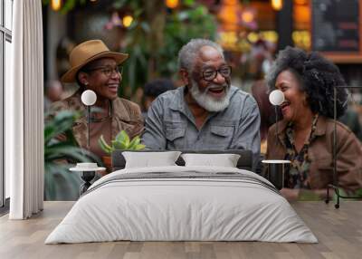 Two elderly women and an elderly man engage in a pleasant conversation while having coffee in a botanical cafe, enjoying the daily life of people in retirement. Wall mural