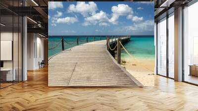 Wooden pier walkway on a beach with turquoise sea at  Speightstown Barbados Wall mural