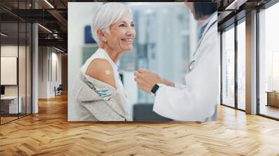 Medical, blood pressure or checkup with a doctor and patient in the hospital for a health appointment. Healthcare, insurance and consulting with a woman medicine professional and senior in a clinic Wall mural