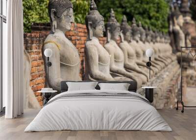 Buddha statues at historic temples of Ayutthaya in Thailand. Wall mural