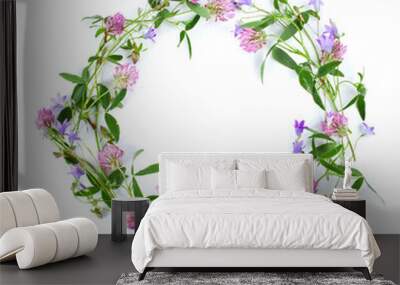 Beautiful wreath with colorful flowers isolated on a white background. Midsummer celebration concept, summer decoration. Top view. Wall mural