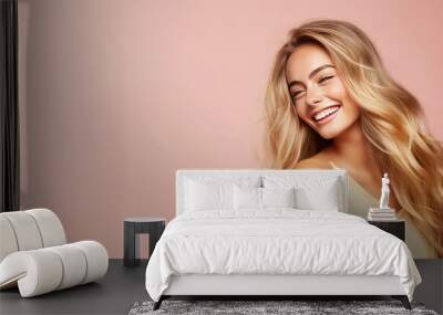 Smiling young woman with blonde long groomed hair isolated on pastel flat background with copy space. Blonde hair care products banner template, hair salon. Wall mural