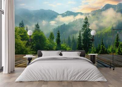 View from the empty wooden terrace over the mountains and forest in summer morning fog. Nature relax wallpaper. Wall mural