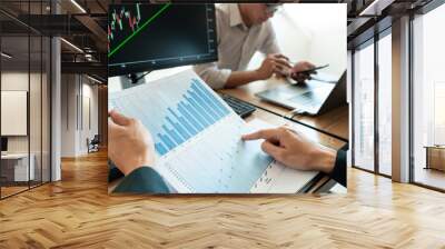 Business team investment Entrepreneur Trading discussing and analysis graph stock market in traders office. Business financial exchange concept Wall mural