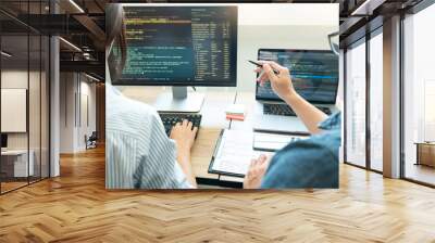 Collaborative work Software engineers website developer technologies or programmer working coding on startup ai application project on screen with partner in coworking space office company. Wall mural