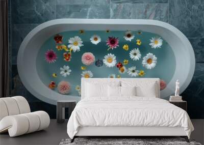 A white bath with water and flowers floating in it Wall mural