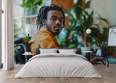 portrait of black man sitting in wheelchair office desk  Wall mural