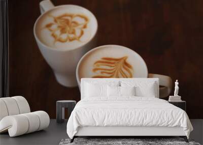 Two cups of latte on brown wooden table Wall mural