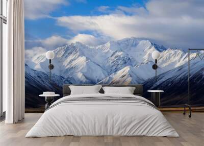 Snow-capped Mountains Under a Clear Blue Sky Wall mural