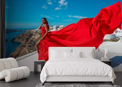 Europe Tourist Travel Woman In Oia Santorini - Greek Islands Vacation Red Fluttering Dress. Wall mural