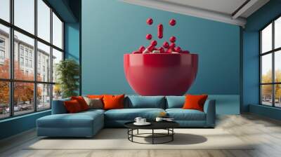 Red bowl with red and pink pills balls on blue background. Wall mural