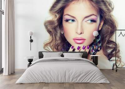 beautiful model with curly hair and purple manicure
 Wall mural