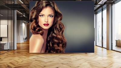 Beautiful model with long curly hair . fashion trend image ,the girl with blue eyes , fashion makeup and Hairstyle curls

 Wall mural