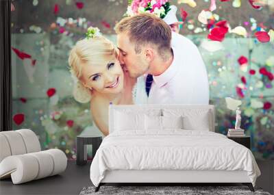 Beautiful wedding couple , groom kisses the bride Wall mural