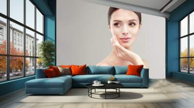 Beautiful Young Woman with Clean Fresh Skin . Facial treatment . Cosmetology , beauty and spa . Beauty skin famale face Wall mural