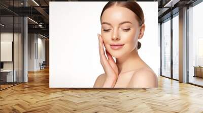 Beautiful Young Woman with Clean Fresh Skin . Facial  treatment   . Cosmetology , beauty  and spa . Nice and attractive girl with a pleasant smile. Wall mural