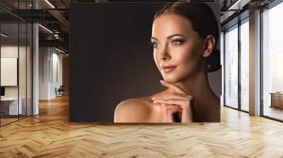 Beautiful young woman with clean fresh skin  .Girl  beauty face care. Facial  treatment   . Wall mural