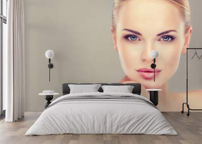 Beautiful Young Woman with Clean Fresh Skin close up . Skin care face . Cosmetology Wall mural