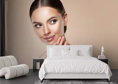 Beautiful young woman with clean fresh skin on face . Girl facial  treatment   . Cosmetology , beauty  and spa . Wall mural