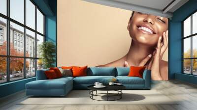 Beauty portrait of African American girl . Beautiful black woman touch her face . Facial  treatment . Cosmetology , skin care  and spa .  Wall mural