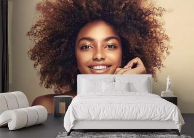 Beauty portrait of african american woman with clean healthy skin on beige background. Smiling beautiful afro girl.Curly black hair. Black teen girl Wall mural