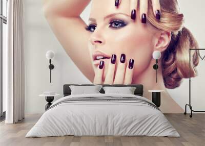 blonde model in burgundy manicure and stylish hairstyle Wall mural