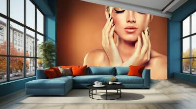 Girl with the Golden makeup and metal nails. Wall mural