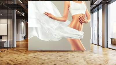 Perfect slim toned young body of the girl . An example of sports , fitness or plastic surgery and aesthetic cosmetology.	

 Wall mural