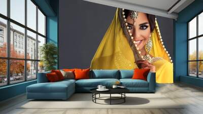 Portrait of a beautiful indian girl  .India woman in traditional sari dress and jewelry. Wall mural