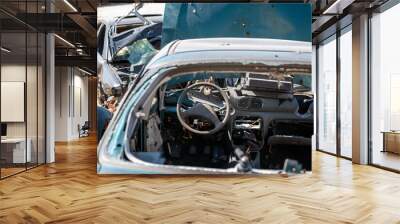 damaged and looted cars in a city in Ukraine during the war Wall mural